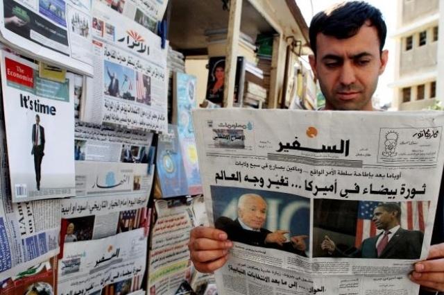 Man reading a newspaper in Lebanon. Photo by Hurriyet.